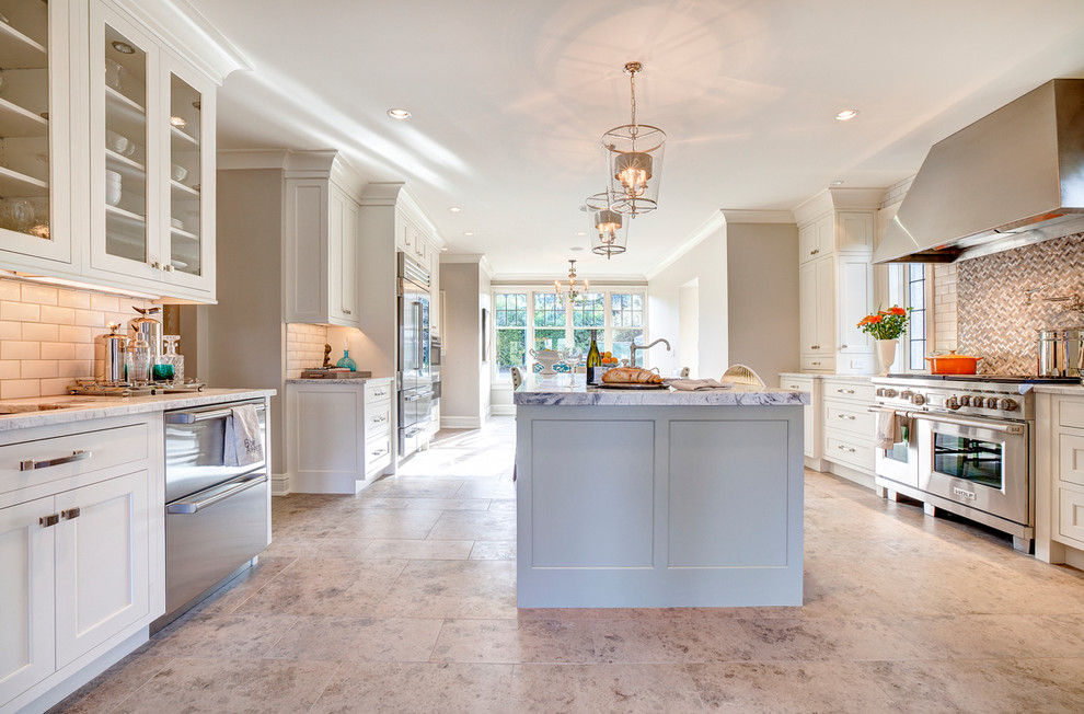 Example of a large transitional u-shaped porcelain tile and beige floor eat-in kitchen design in Phoenix with an undermount sink, recessed-panel cabinets, white cabinets, granite countertops, white backsplash, ceramic backsplash, stainless steel appliances and an island