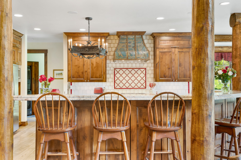 Open concept kitchen - rustic open concept kitchen idea with medium tone wood cabinets, granite countertops and stainless steel appliances