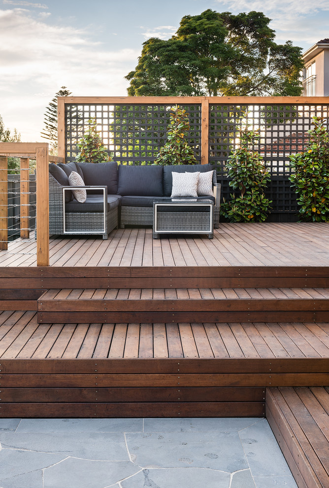 Design ideas for a large modern backyard deck in Melbourne with no cover.