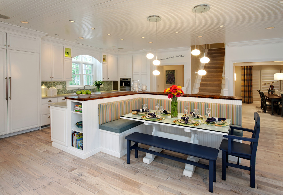 Inspiration for a contemporary kitchen in Indianapolis with wood benchtops, raised-panel cabinets, white cabinets, multi-coloured splashback and stainless steel appliances.