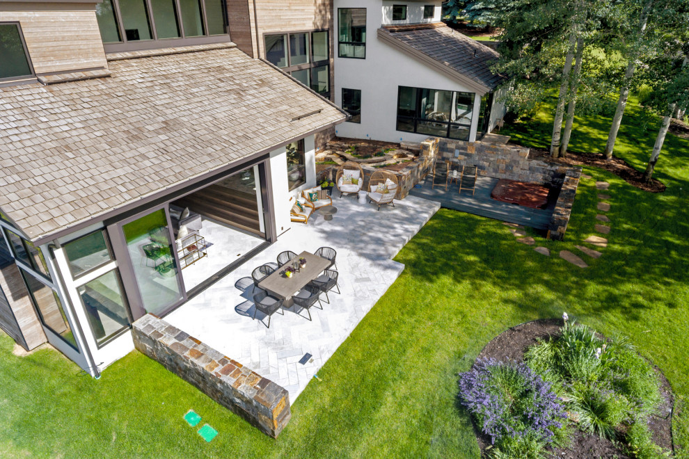 Example of a mountain style home design design in Denver