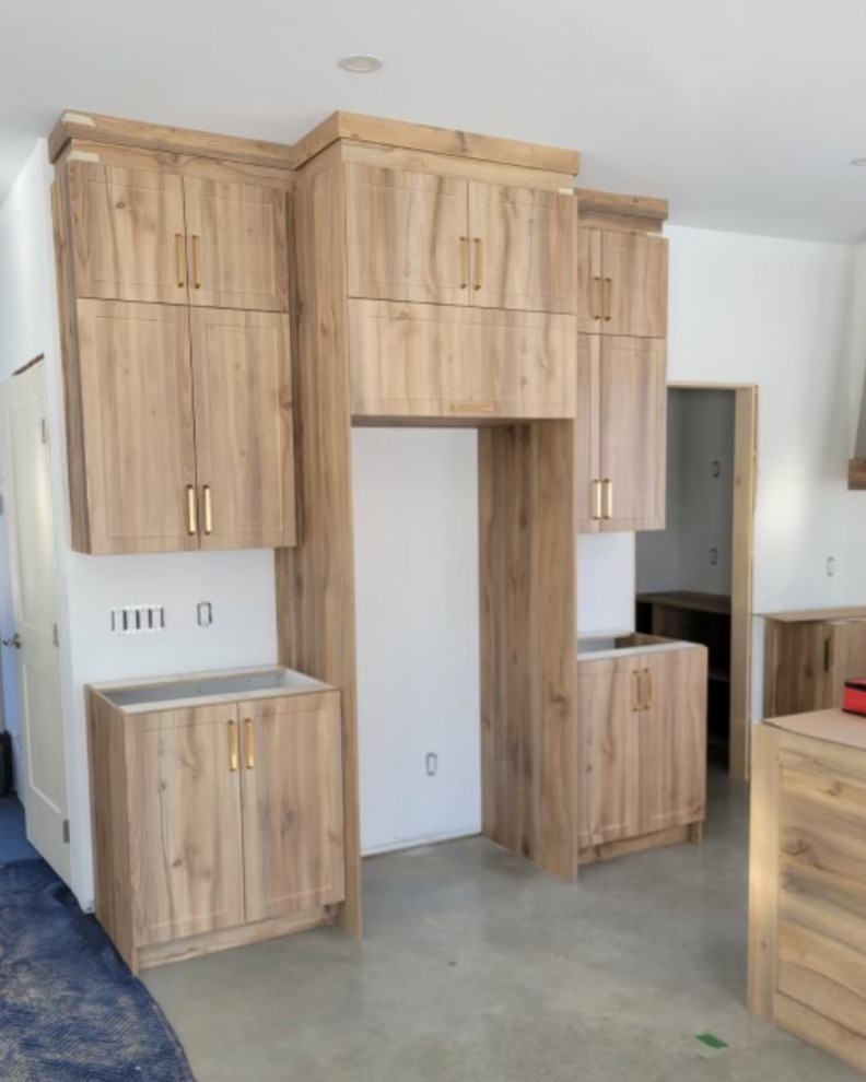 Kitchen - rustic kitchen idea in Miami with light wood cabinets and an island