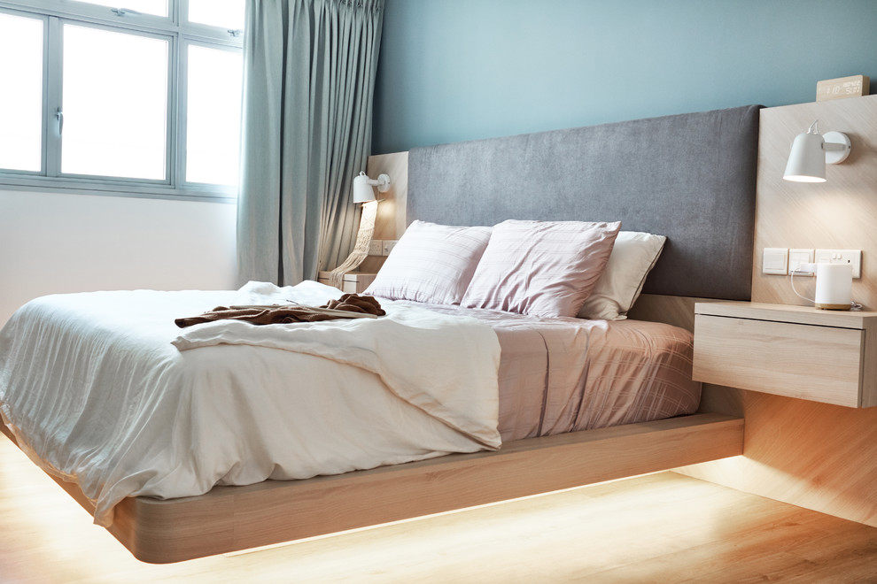 Photo of a Scandinavian bedroom in Singapore.