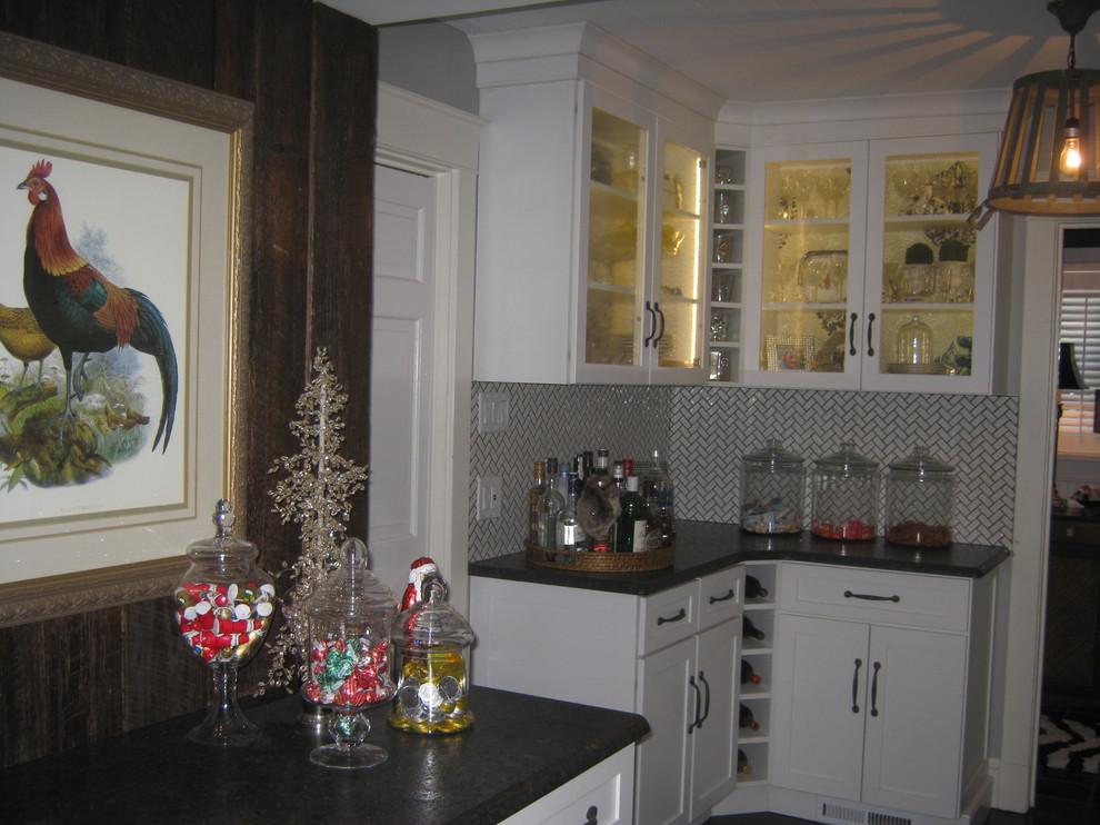 Photo of a country kitchen pantry in Other with an undermount sink, white cabinets, granite benchtops, white splashback, subway tile splashback and no island.