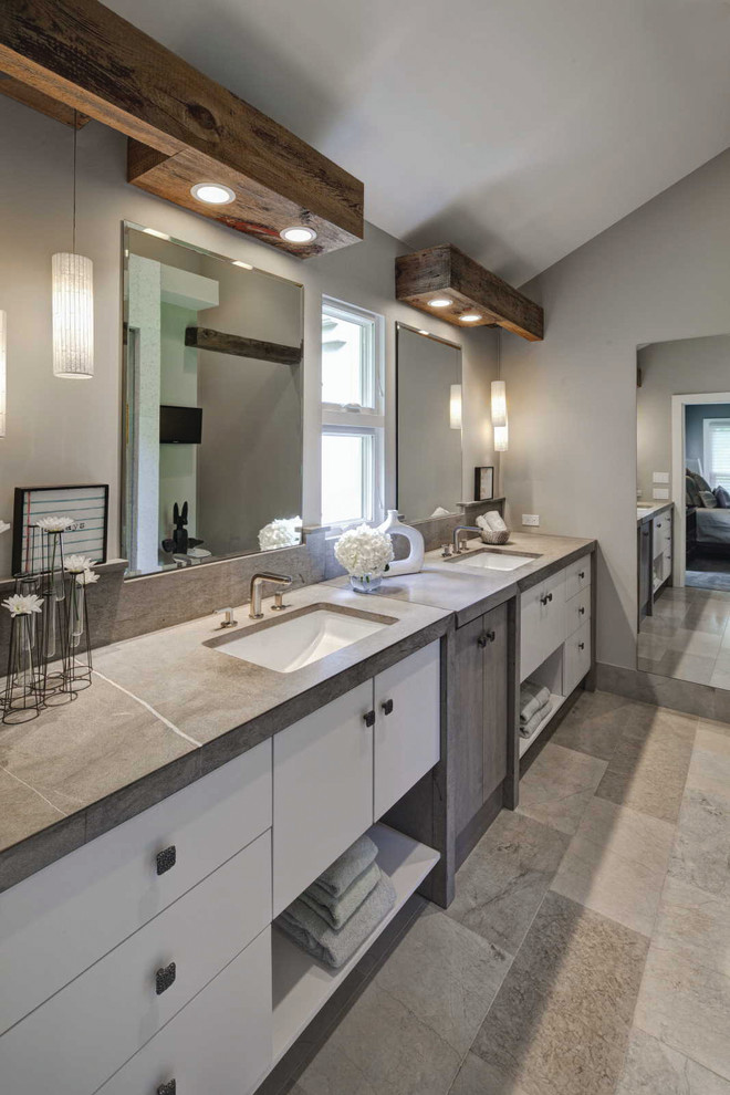 This is an example of a large contemporary master bathroom in Chicago with an undermount sink, flat-panel cabinets, white cabinets, grey walls, an alcove shower, a one-piece toilet, mosaic tile, marble benchtops and a hinged shower door.