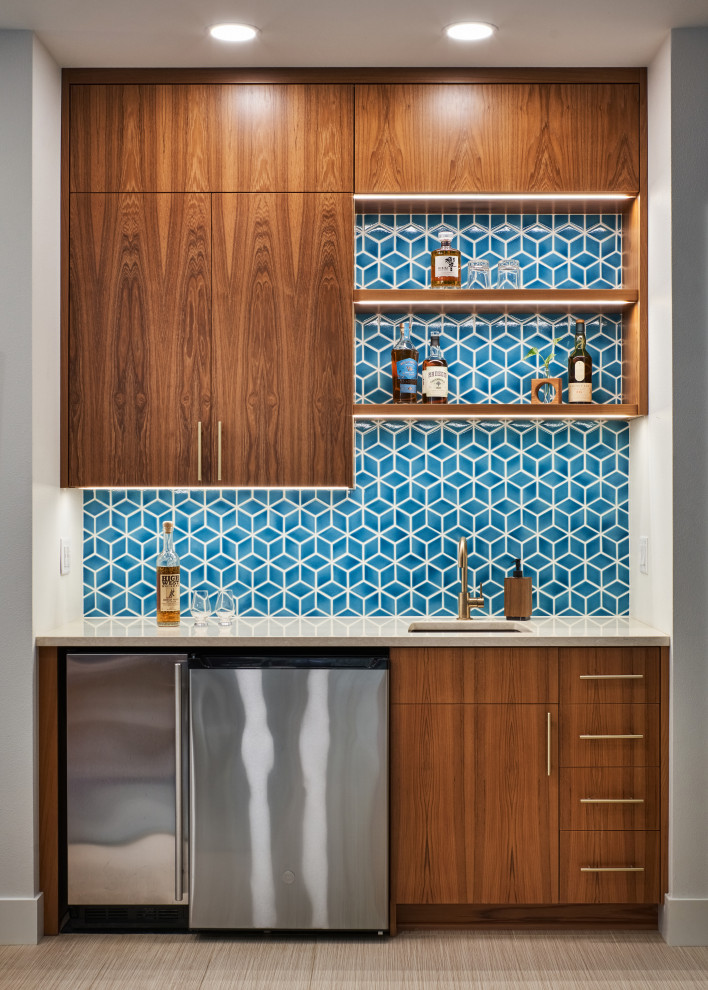 Inspiration for a small midcentury single-wall wet bar in Other with an undermount sink, flat-panel cabinets, medium wood cabinets, quartz benchtops, blue splashback, ceramic splashback, porcelain floors, beige floor and white benchtop.