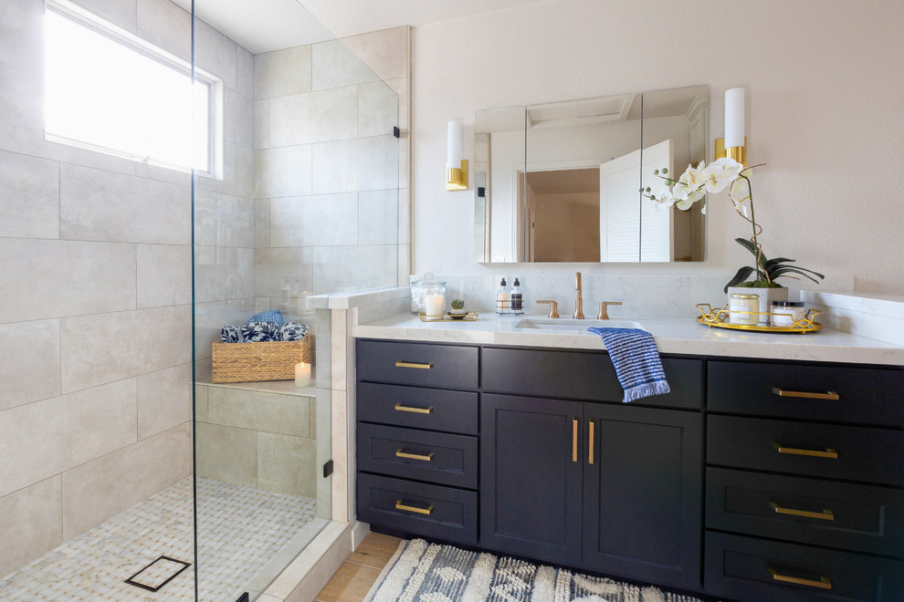 Inspiration for a transitional 3/4 bathroom in Sacramento with shaker cabinets, blue cabinets, an alcove shower, white walls, medium hardwood floors, an undermount sink, beige floor, a hinged shower door and grey benchtops.