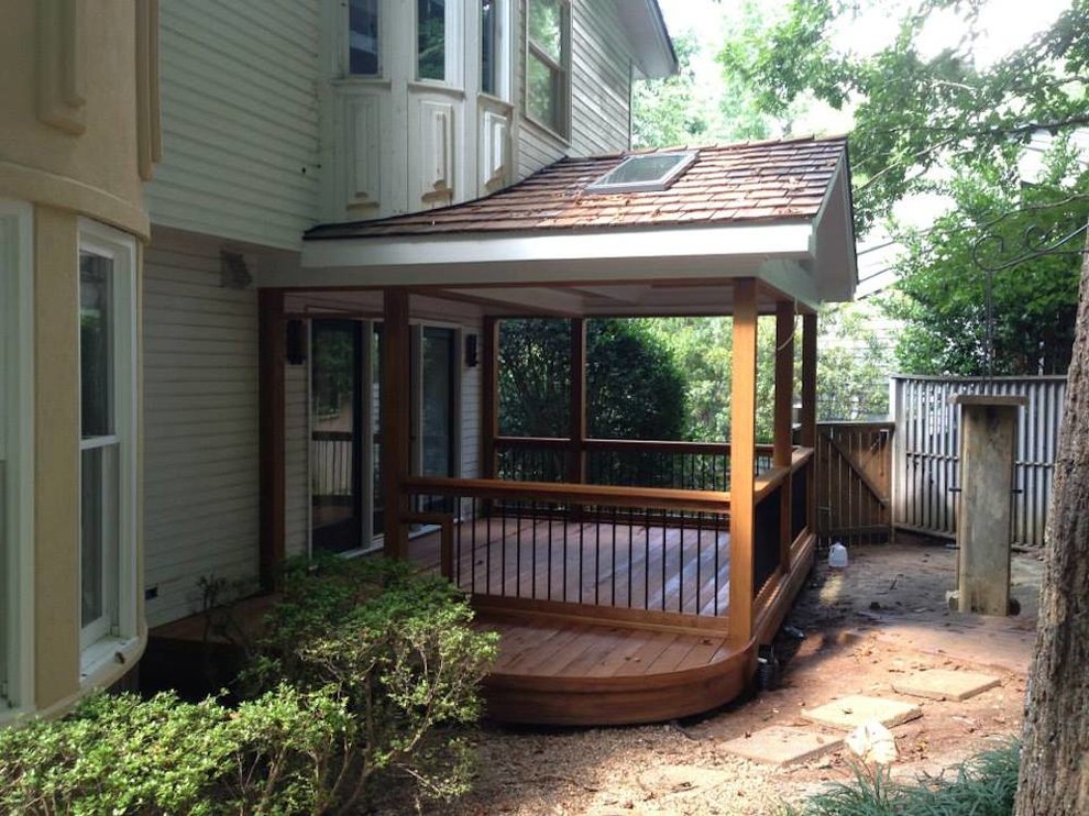 Deck - small transitional side yard deck idea in Raleigh with a roof extension
