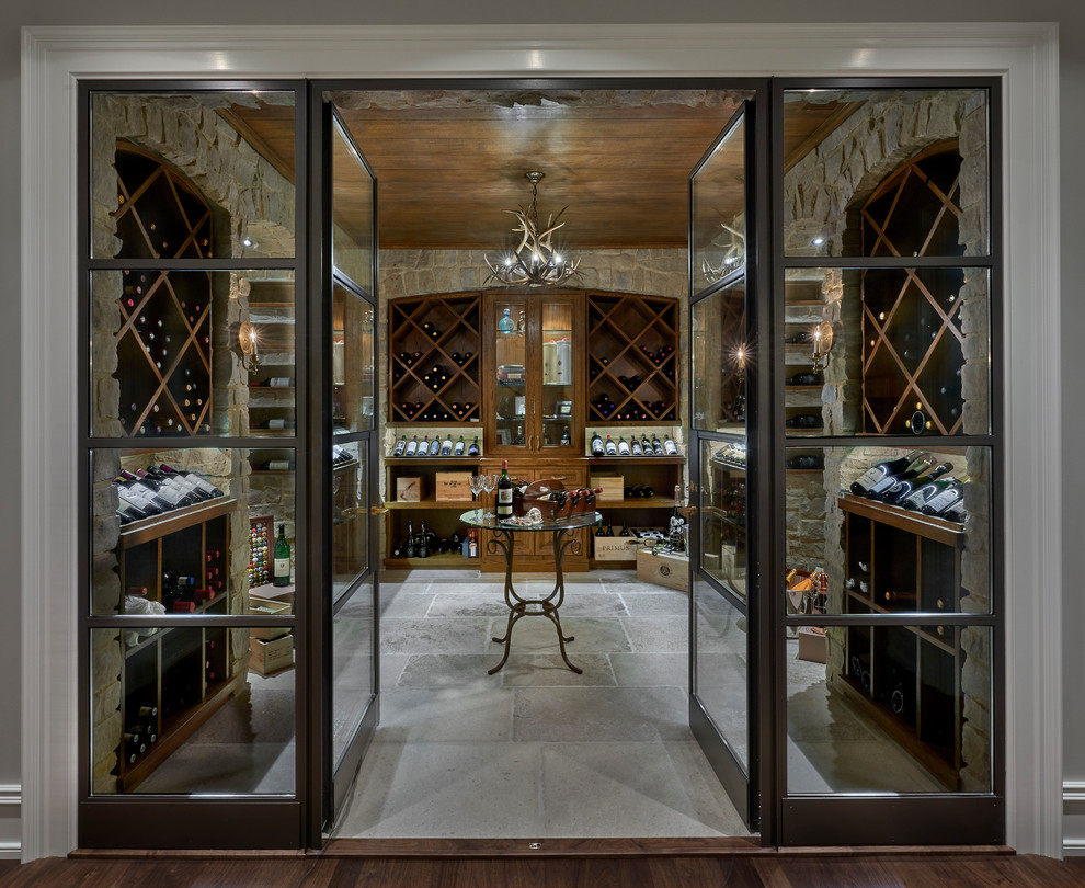Large transitional wine cellar in Chicago with limestone floors and diamond bins.