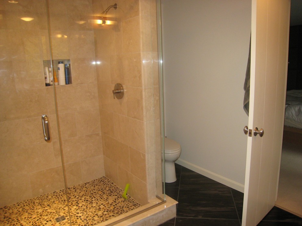 Example of a mid-sized transitional master beige tile and pebble tile alcove shower design in Boston with a two-piece toilet, white walls, flat-panel cabinets, medium tone wood cabinets, an undermount sink and granite countertops