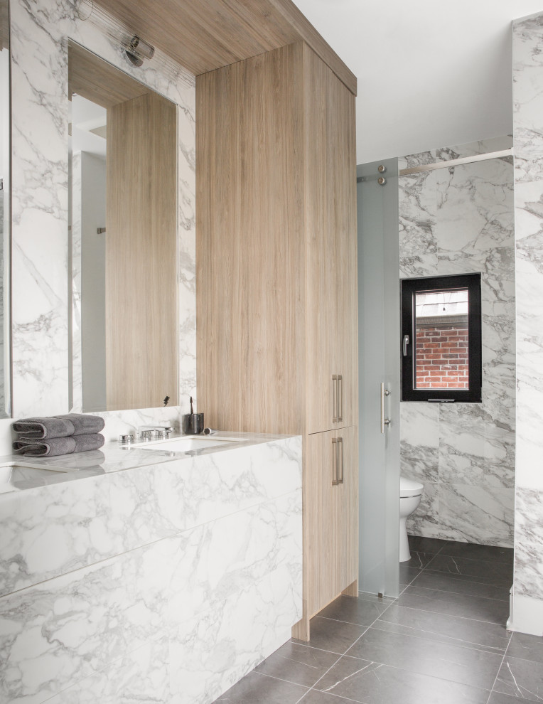 Photo of a contemporary bathroom in New York with white cabinets, an alcove shower, gray tile, an undermount sink, grey floor, a sliding shower screen, white benchtops, a double vanity and a built-in vanity.