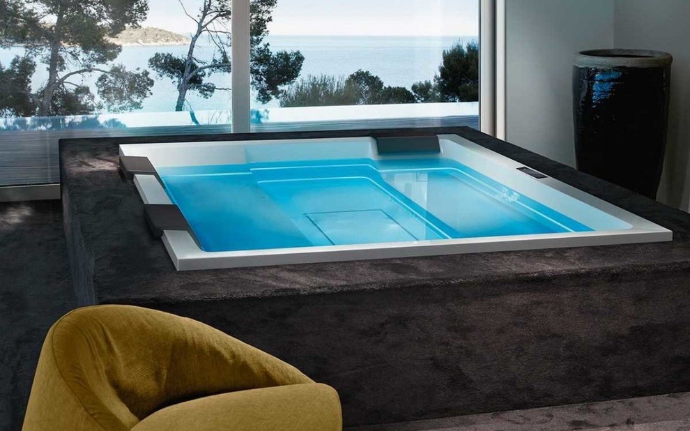 Inspiration for an expansive modern indoor rectangular aboveground pool in Miami with a hot tub.
