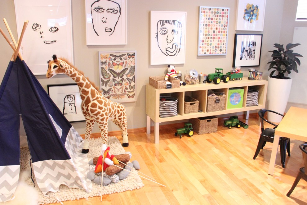 Inspiration for a mid-sized modern gender-neutral kids' playroom in Other with beige walls and light hardwood floors.