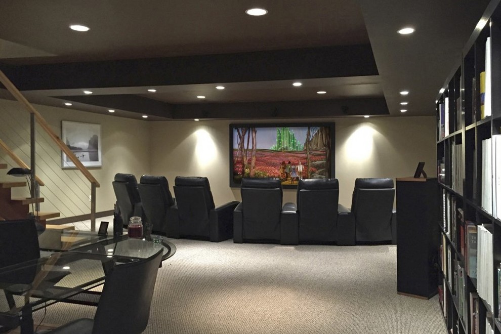 Photo of a small transitional home theatre in Philadelphia with beige walls, carpet and a wall-mounted tv.