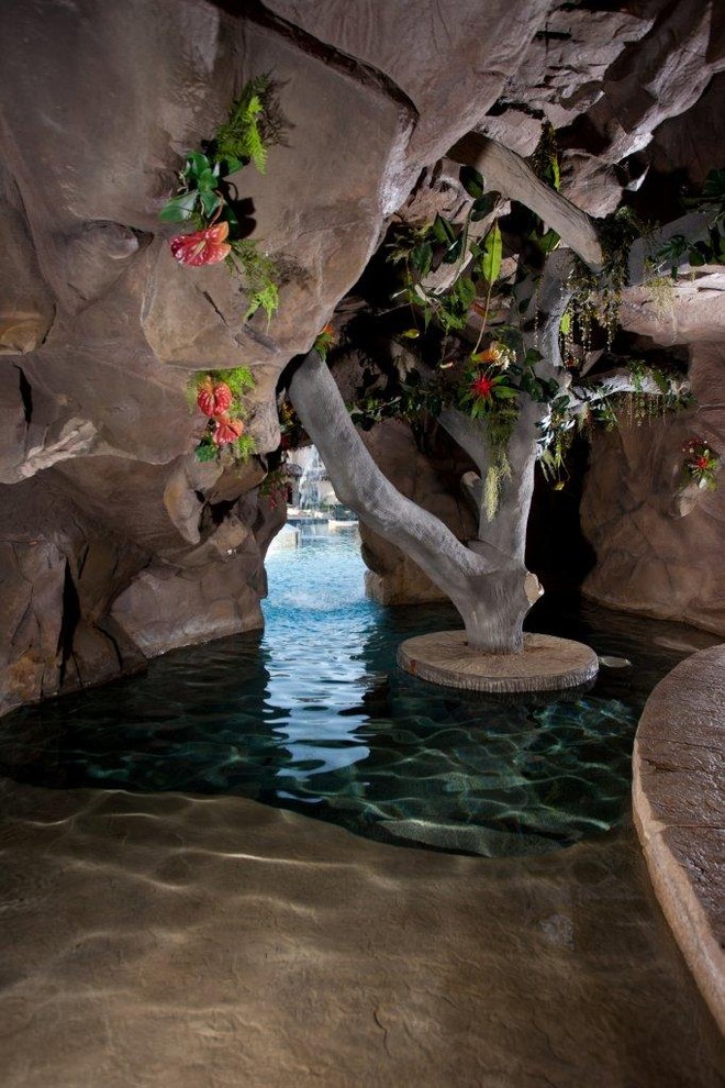 Inspiration for a tropical natural pool in Houston.