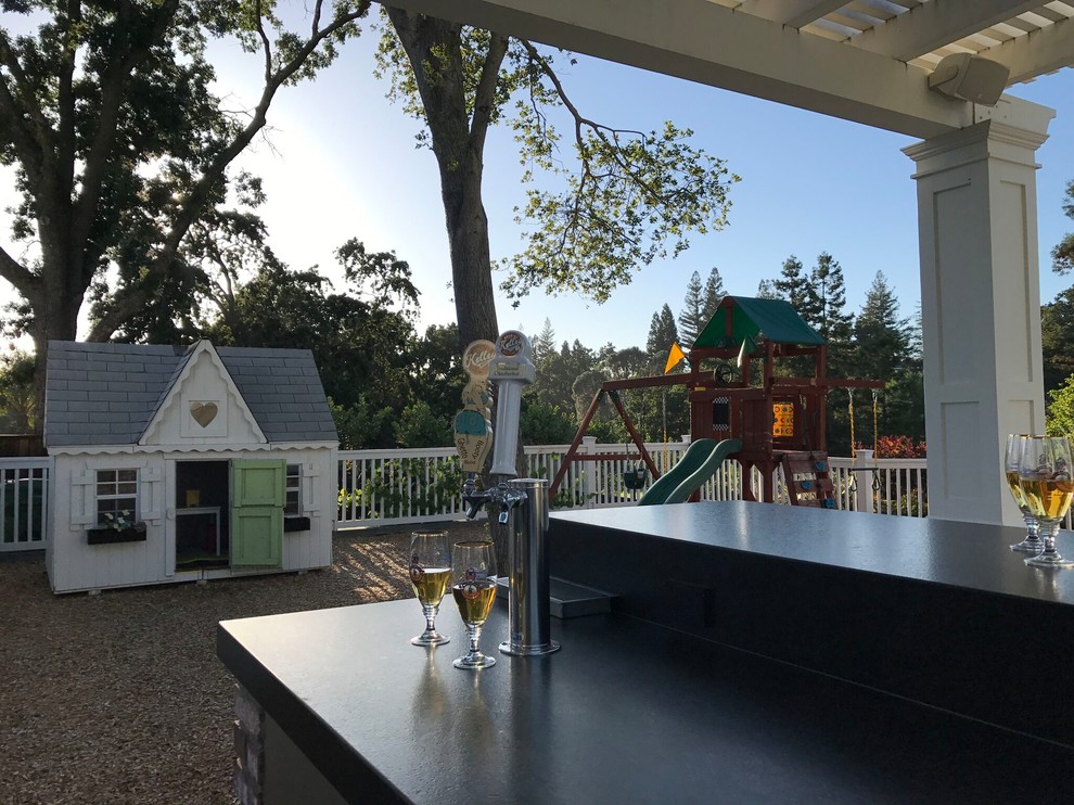 This is an example of a large traditional backyard garden in San Francisco with with outdoor playset.