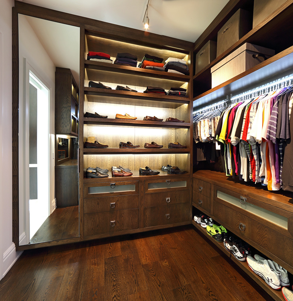 Inspiration for a large contemporary men's walk-in wardrobe in Baltimore with open cabinets, dark wood cabinets and dark hardwood floors.
