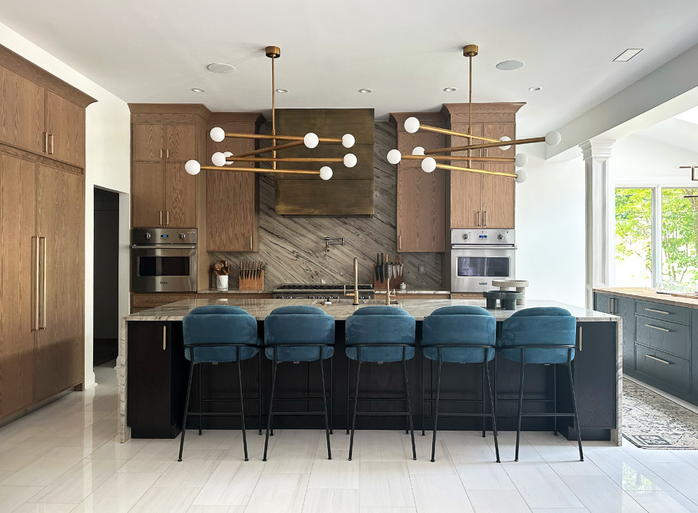 Inspiration for a large mid-century modern marble floor and white floor kitchen remodel in DC Metro with shaker cabinets, medium tone wood cabinets, quartzite countertops, stainless steel appliances, two islands and gray countertops