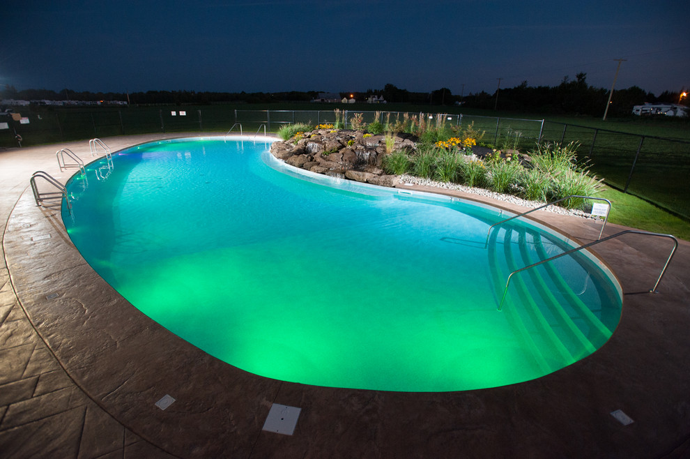Huge mountain style courtyard stamped concrete and freeform natural pool fountain photo