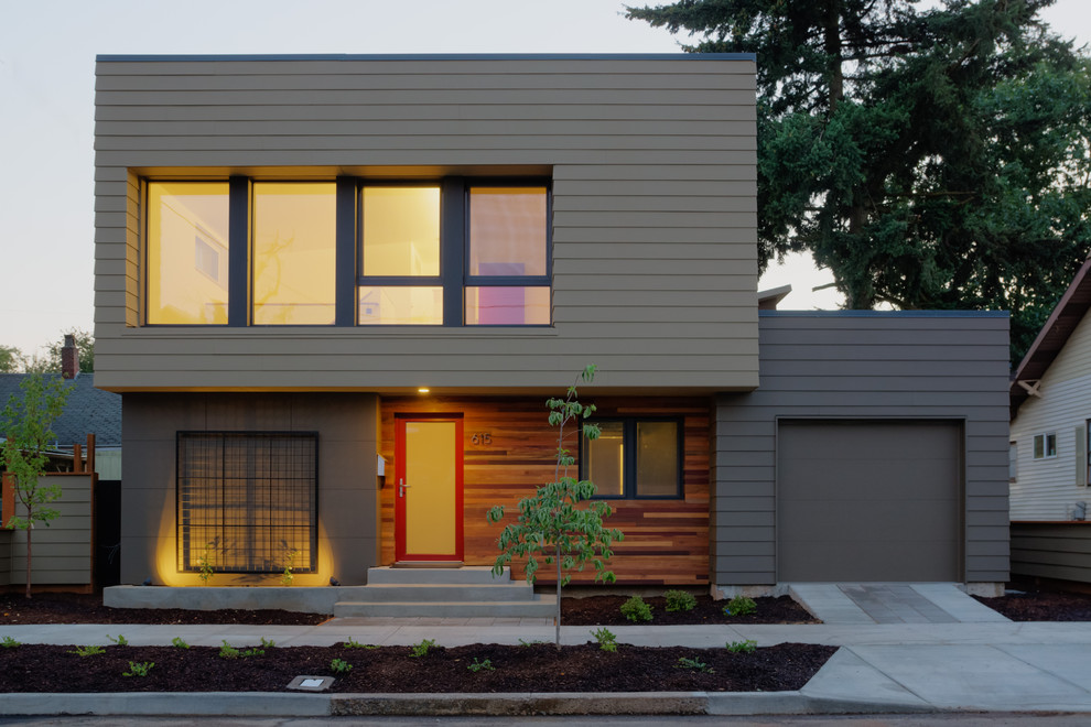 Small modern two-storey brown exterior in Portland with concrete fiberboard siding and a flat roof.