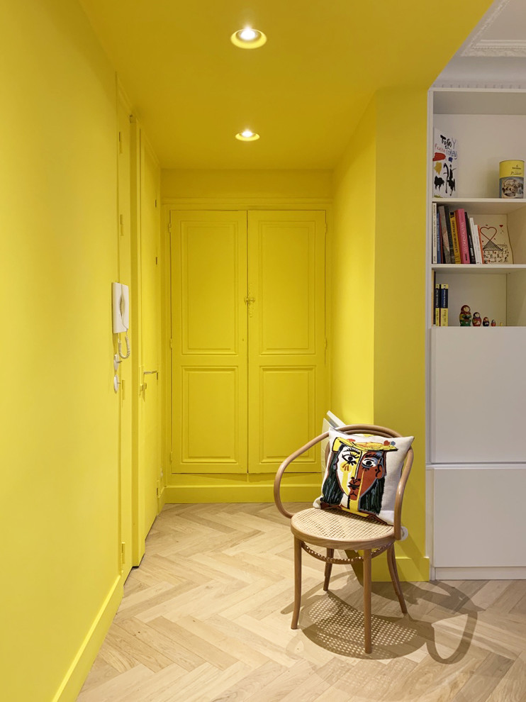 This is an example of an entryway in Paris with yellow walls.