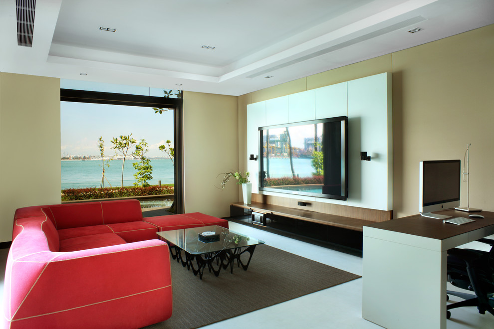 Mid-sized contemporary enclosed home theatre in Singapore with beige walls, marble floors and a wall-mounted tv.