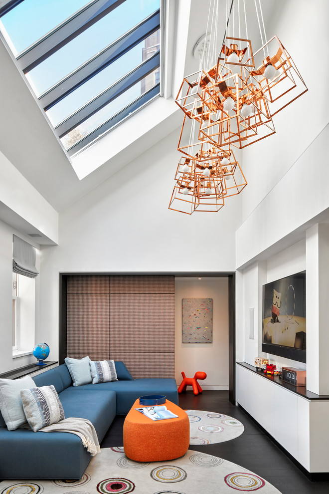 This is an example of a contemporary gender-neutral kids' room in New York with white walls and dark hardwood floors.