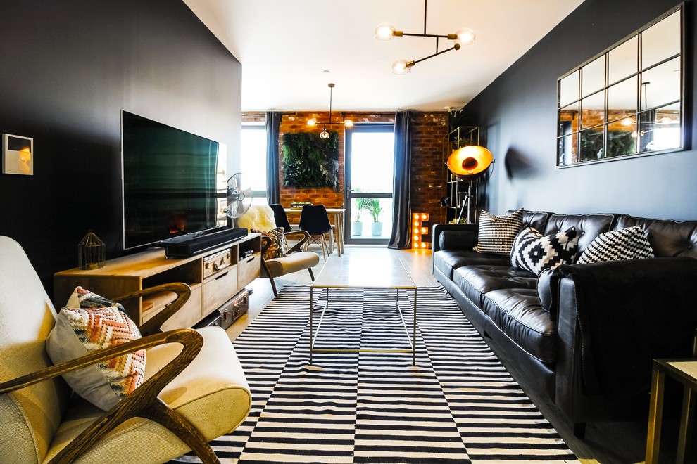 Photo of a medium sized contemporary formal open plan living room in Kent with black walls, a freestanding tv and beige floors.