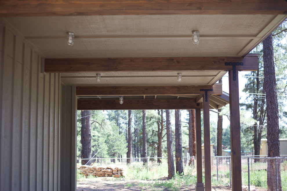 Example of a mountain style home design design in Phoenix