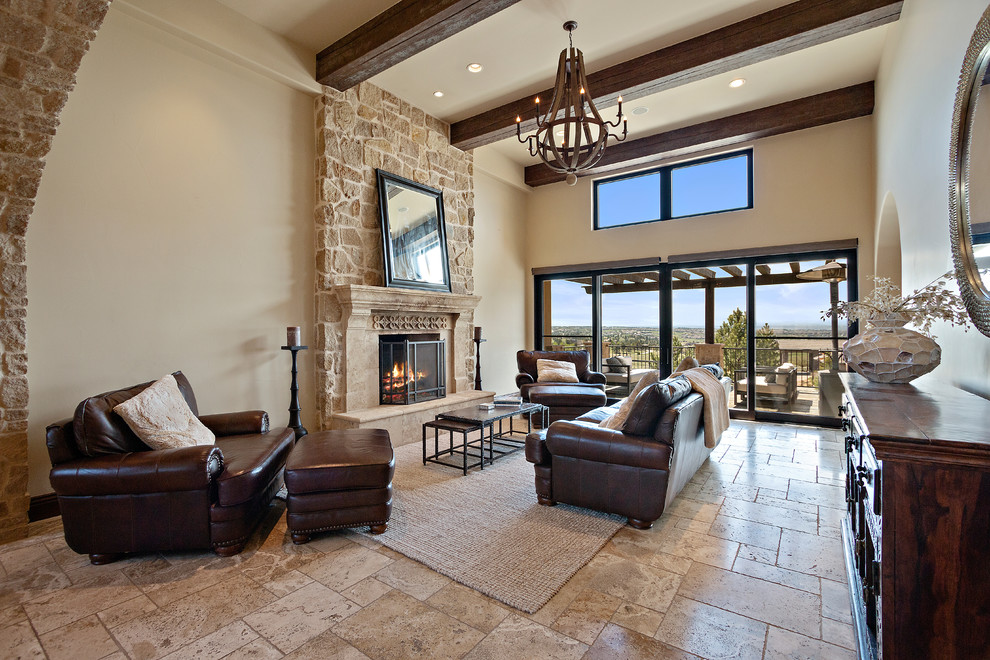 Inspiration for an expansive mediterranean formal enclosed living room in San Diego with beige walls, porcelain floors, a standard fireplace, a tile fireplace surround, no tv and beige floor.