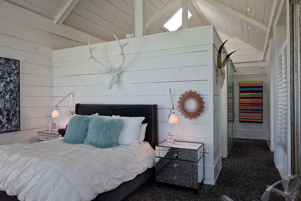 This is an example of a country bedroom in Toronto with white walls and carpet.