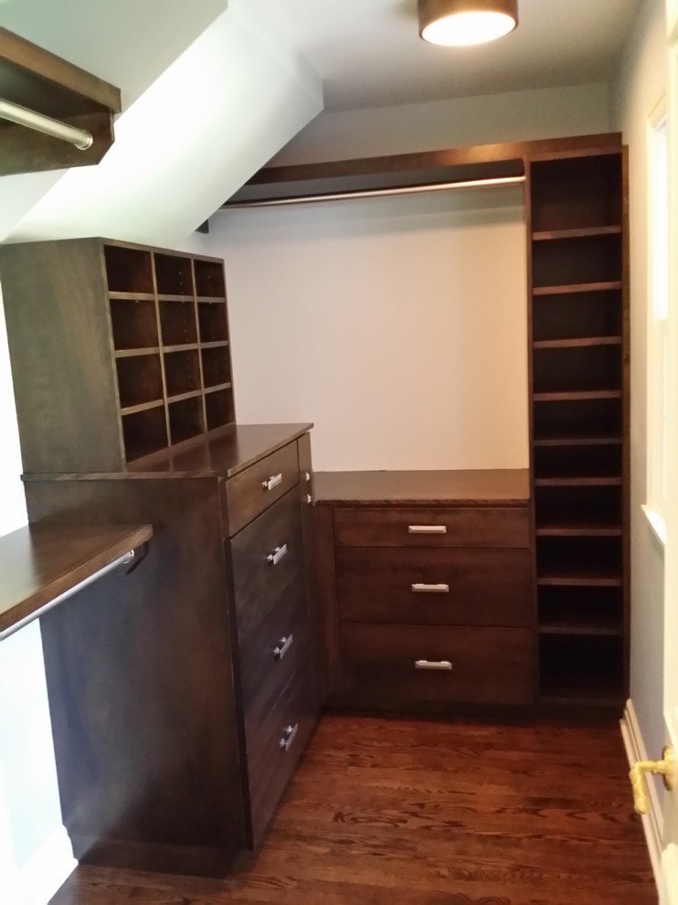 Small modern men's walk-in wardrobe in Other with flat-panel cabinets, dark wood cabinets and medium hardwood floors.