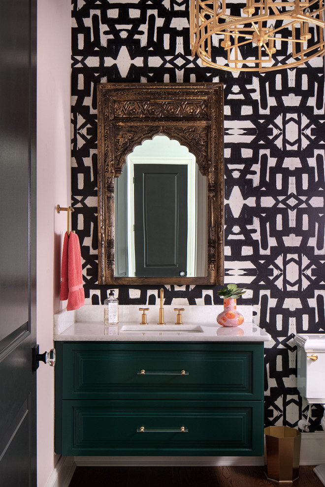 Design ideas for a small traditional cloakroom in Richmond with raised-panel cabinets, green cabinets, a two-piece toilet, pink walls, medium hardwood flooring, a submerged sink, quartz worktops, brown floors, white worktops, a floating vanity unit and wallpapered walls.