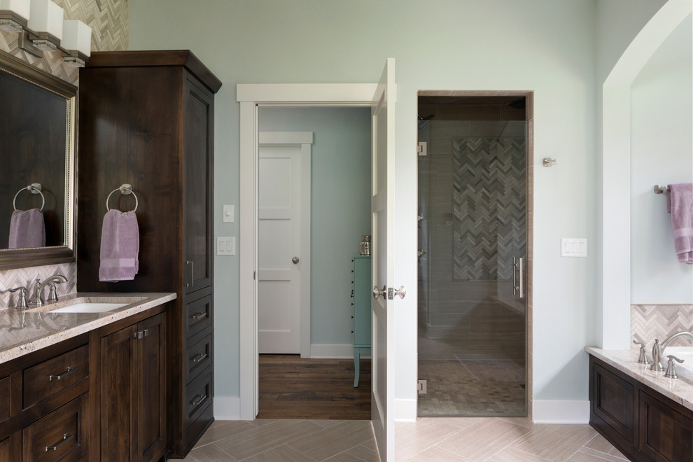 Large transitional master bathroom in Milwaukee with furniture-like cabinets, dark wood cabinets, a drop-in tub, a two-piece toilet, beige tile, green walls, an undermount sink, granite benchtops, an alcove shower, ceramic tile and ceramic floors.
