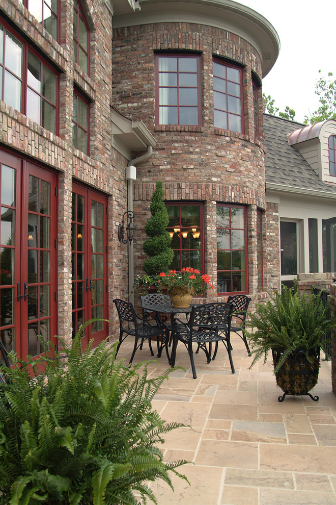 Design ideas for a large traditional three-storey brick red exterior in Nashville with a gable roof.