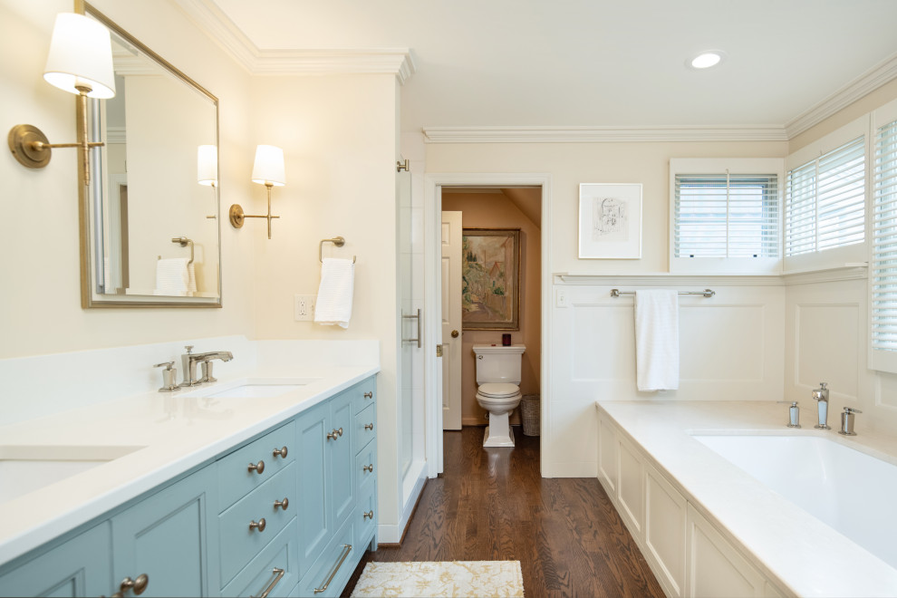 Alcove shower - traditional master double-sink alcove shower idea in Kansas City with blue cabinets, an undermount tub, a two-piece toilet, quartz countertops, white countertops and a built-in vanity