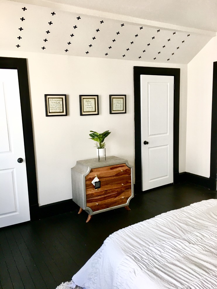Example of a large transitional guest black floor bedroom design with gray walls