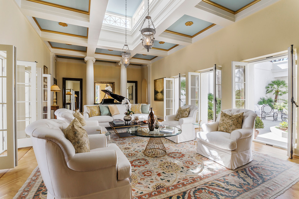 Mid-sized transitional formal open concept living room in Santa Barbara with beige walls and light hardwood floors.