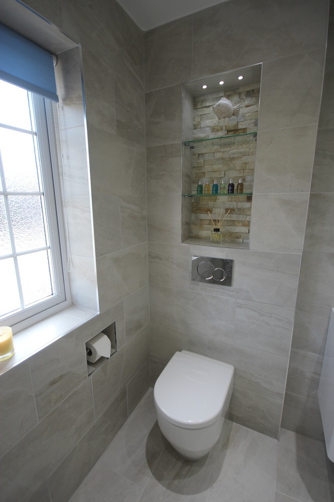 Mid-sized contemporary 3/4 bathroom in Surrey with white cabinets, an open shower, gray tile, porcelain tile, yellow walls, porcelain floors and a wall-mount sink.