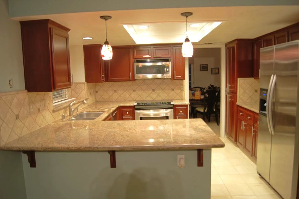 Example of a classic kitchen design in Sacramento with shaker cabinets and medium tone wood cabinets