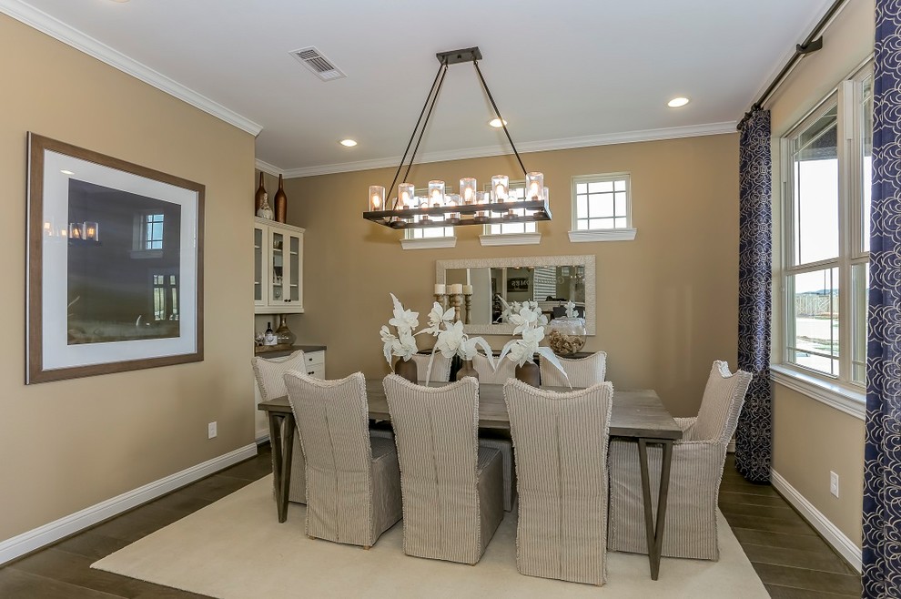 Mid-sized country open plan dining in Other with beige walls, medium hardwood floors and brown floor.