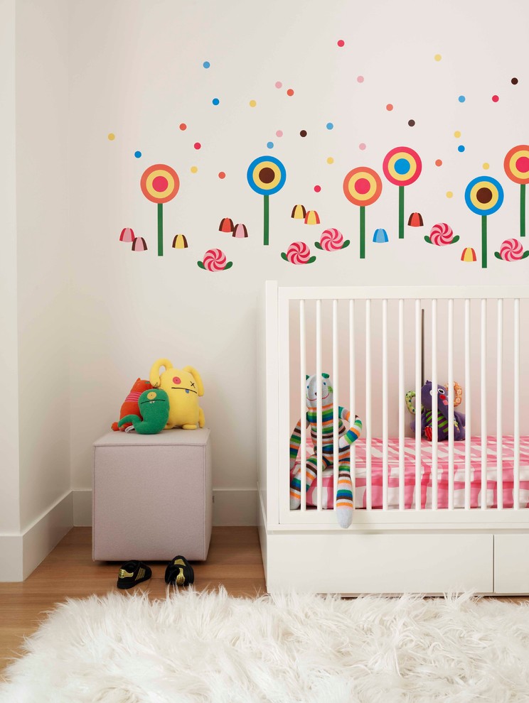 This is an example of a contemporary gender-neutral nursery in New York with multi-coloured walls.