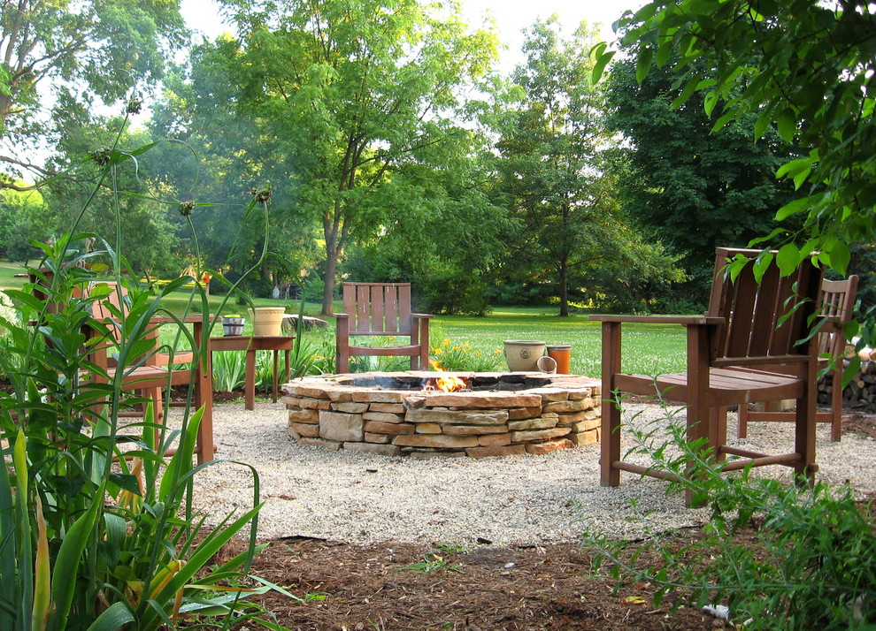 This is an example of a contemporary garden in Milwaukee with a fire feature.