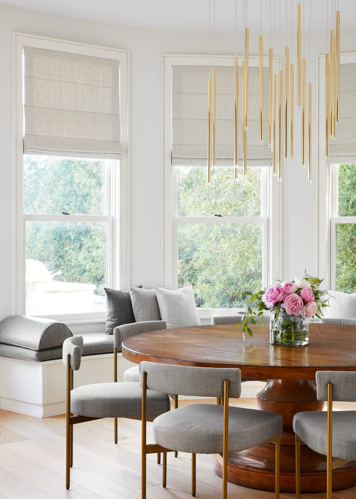 Lakehouse Lux - Example of a beach style dining room design in Chicago
