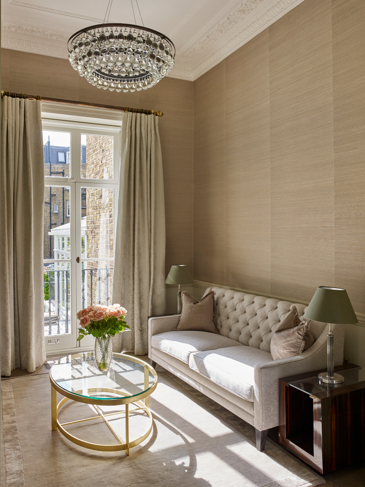 Transitional living room in London with beige walls.