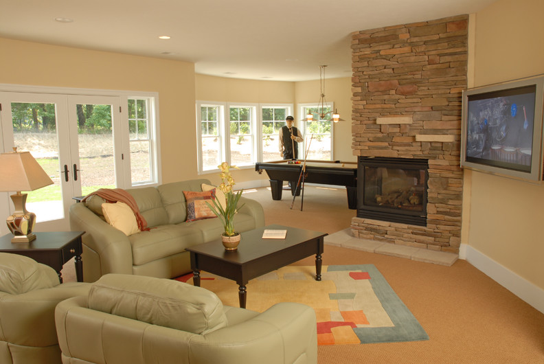 Photo of an eclectic living room in Grand Rapids with carpet, a corner fireplace and a stone fireplace surround.