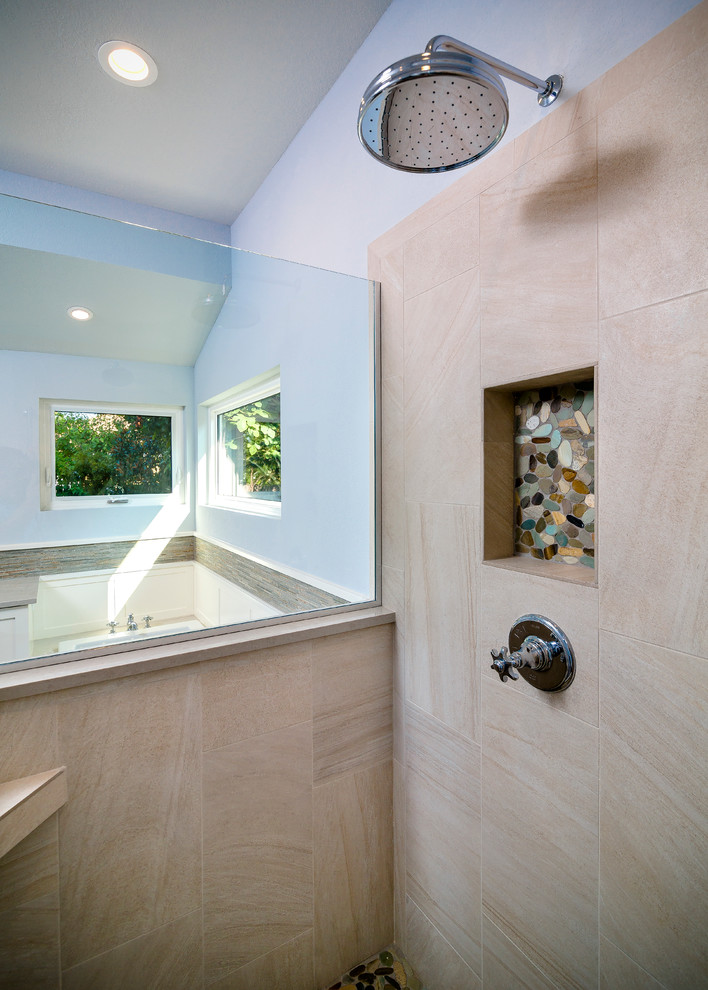 Inspiration for a large transitional master beige tile and porcelain tile porcelain tile and brown floor drop-in bathtub remodel with shaker cabinets, white cabinets, a one-piece toilet, blue walls, an undermount sink, quartz countertops and a hinged shower door