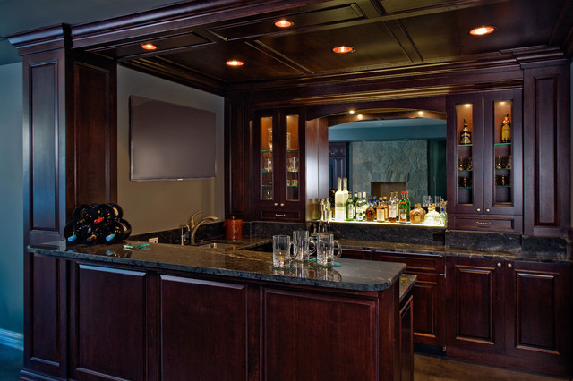 Pub Style Basement Wet Bar Featuring Dark Stained Raised Panel