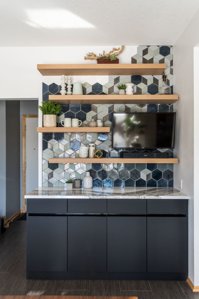 This is an example of a large scandinavian kitchen in Minneapolis with blue splashback, ceramic splashback and black benchtop.