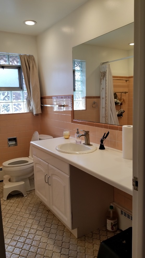 1 weekend to modernize this ugly peachy pink tile bathroom on 250..